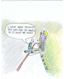 Cartoon of a worker building a curb ramp, telling the inspector he has been doing it this way for 20 years, so it must be right